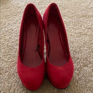 Red suede pumps